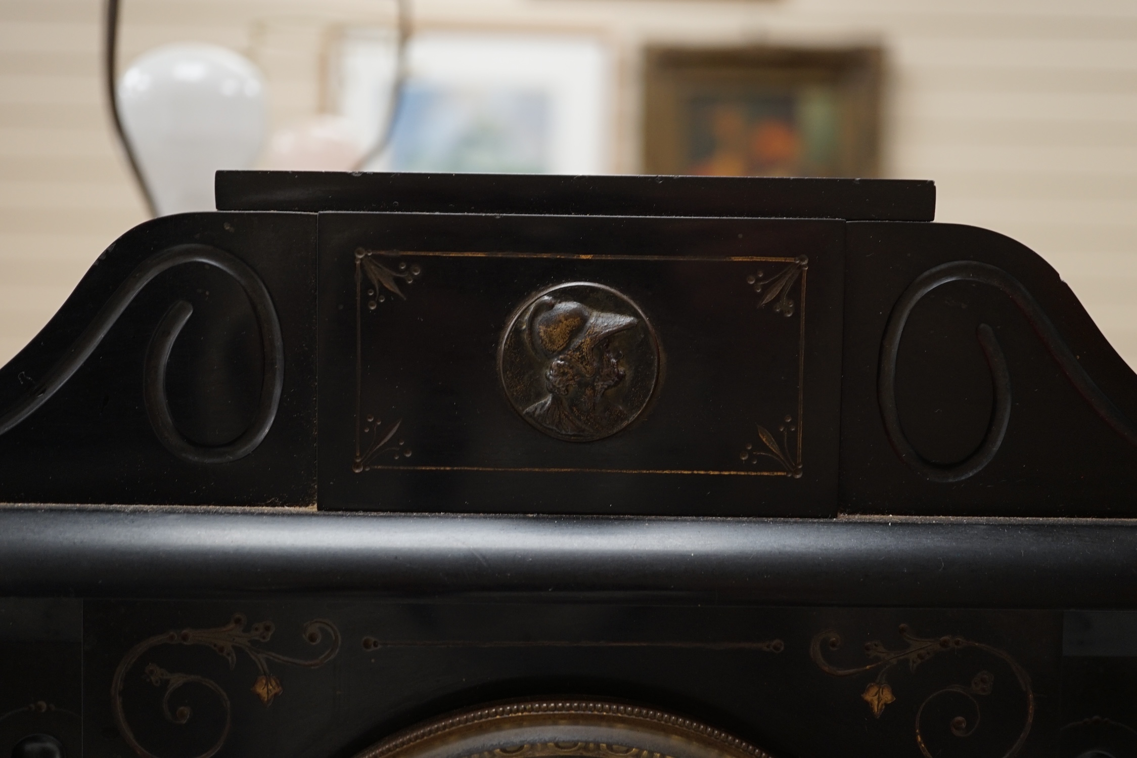 A large black slate mantel clock, with visible Brocot escapement, 45cm high